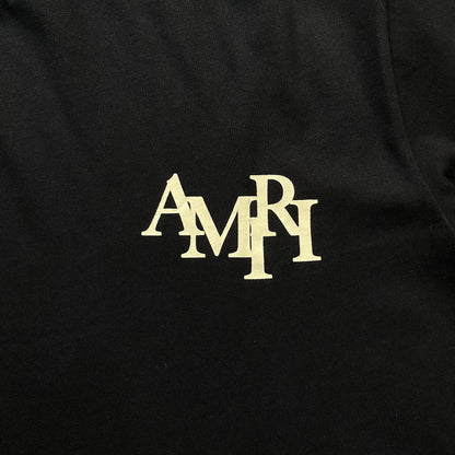 Remera Amiri Champagne Cristal Negra