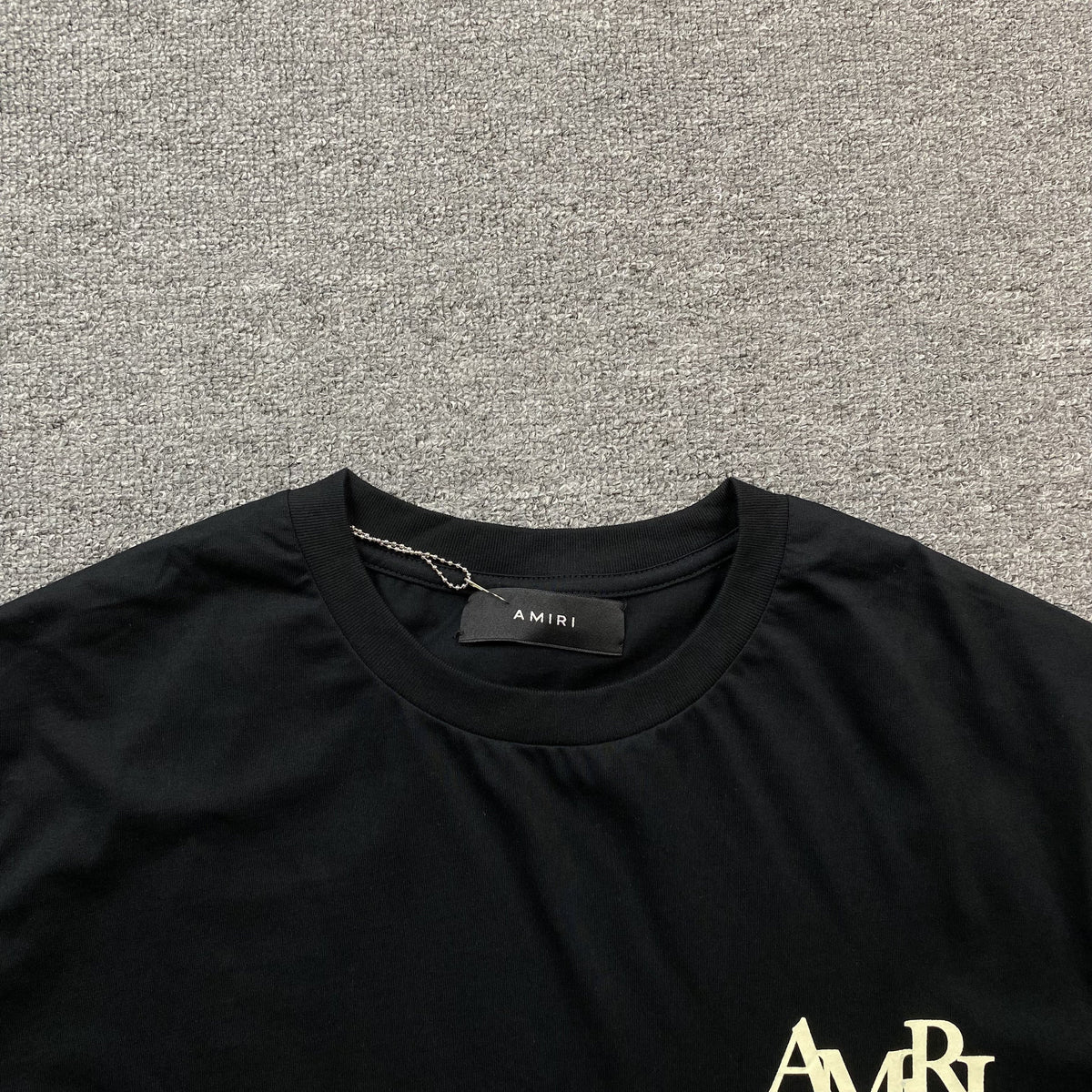 Remera Amiri Champagne Cristal Negra