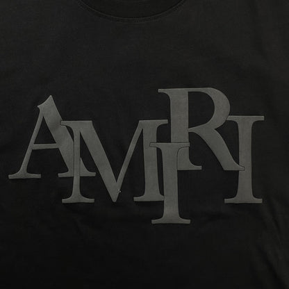 Remera Amiri Staggered Logo Negra