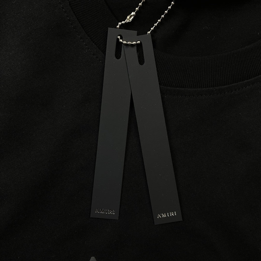 Remera Amiri Staggered Logo Negra