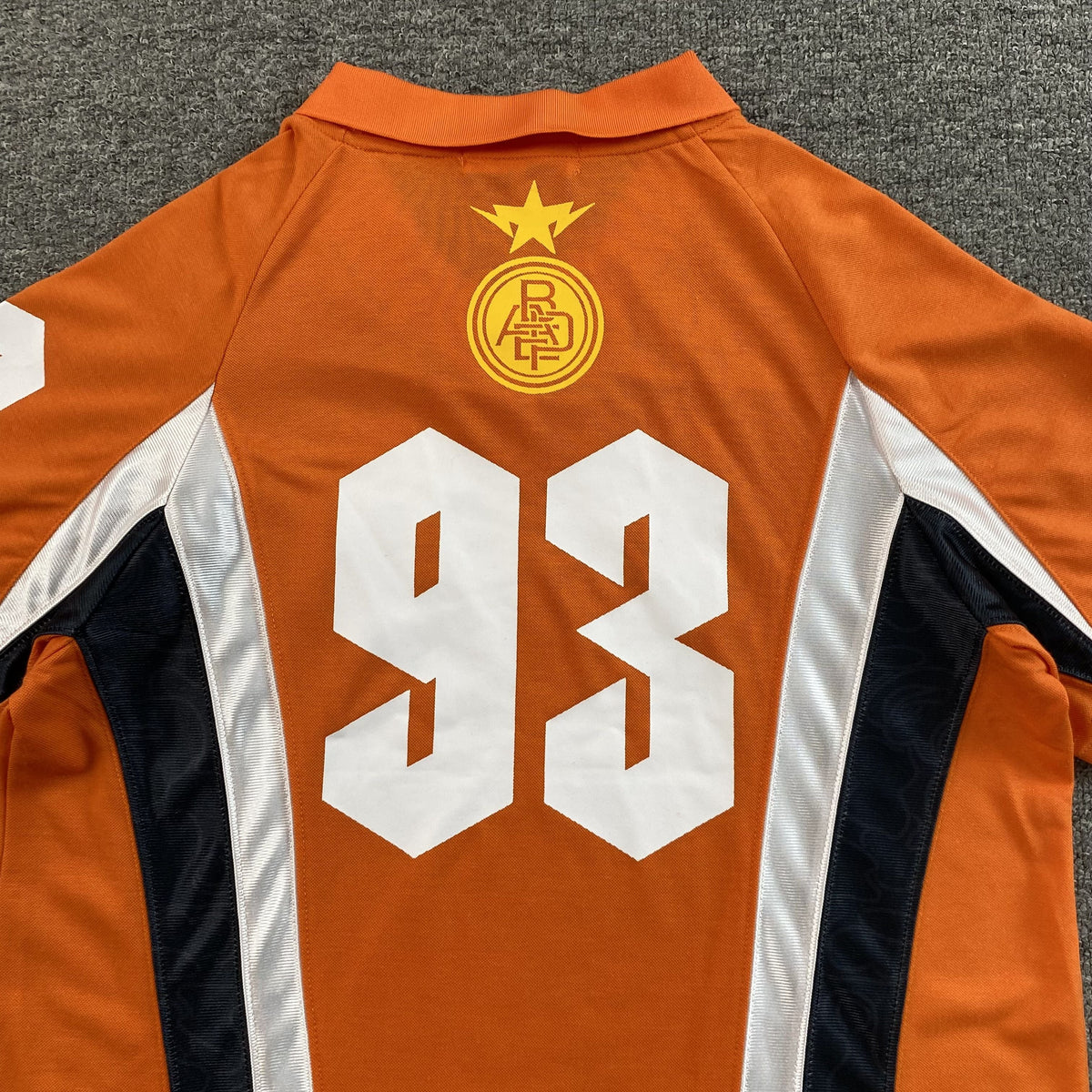 Remera Bape Multi Logo Soccer Jersey Naranja