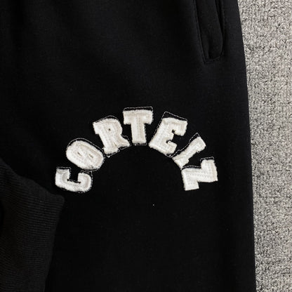 Pantalon Corteiz Colly Arch Open Hem Negro
