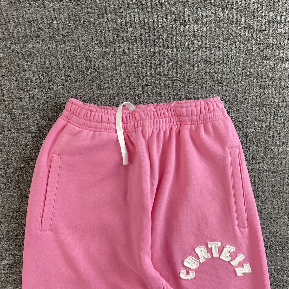 Pantalon Corteiz Colly Arch Open Hem Rosa
