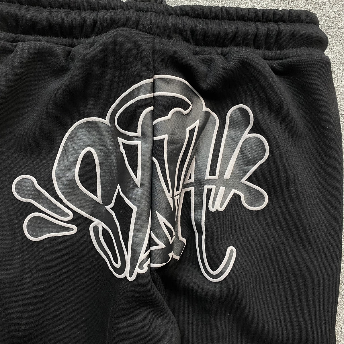 Conjunto Syna World Syna Logo Negro