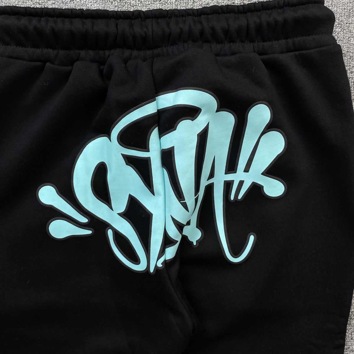 Conjunto Syna World Syna Logo Negro Azul