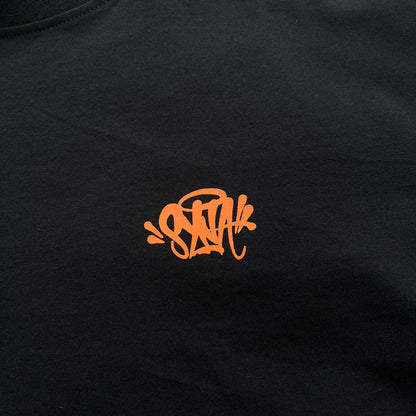 Remera Syna World Synarchy Negra Naranja